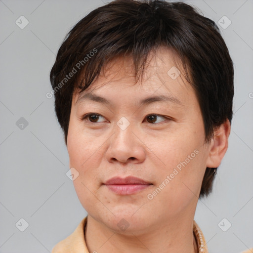 Joyful white adult female with short  brown hair and brown eyes