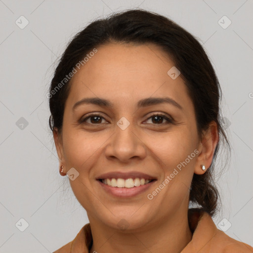 Joyful latino young-adult female with medium  brown hair and brown eyes