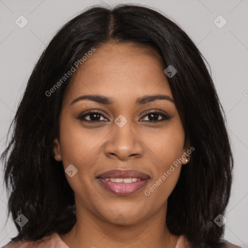 Joyful black young-adult female with long  brown hair and brown eyes