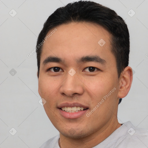 Joyful white young-adult male with short  black hair and brown eyes