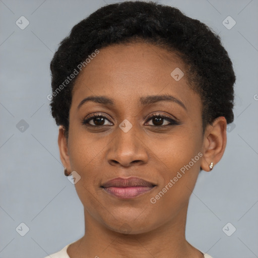 Joyful black young-adult female with short  black hair and brown eyes