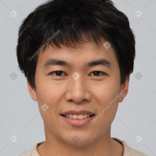 Joyful asian young-adult male with short  brown hair and brown eyes