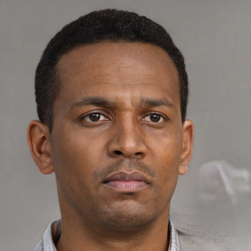 Neutral black young-adult male with short  brown hair and brown eyes