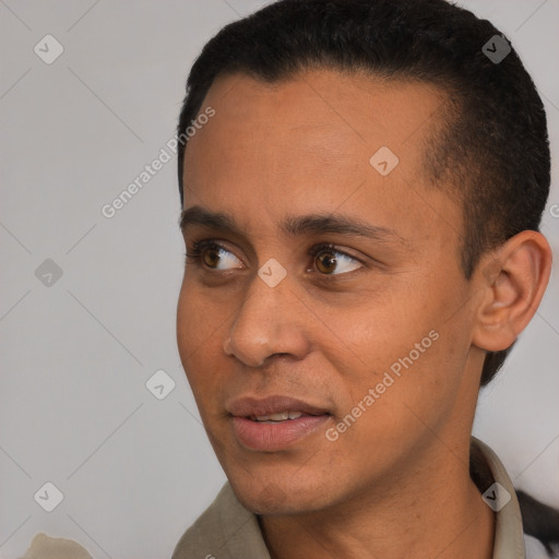 Joyful black young-adult male with short  black hair and brown eyes