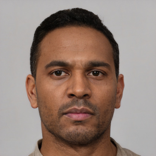 Neutral latino young-adult male with short  brown hair and brown eyes