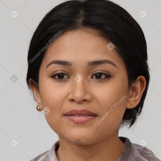 Joyful latino young-adult female with medium  black hair and brown eyes