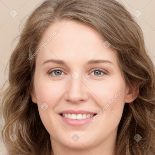 Joyful white young-adult female with long  brown hair and green eyes