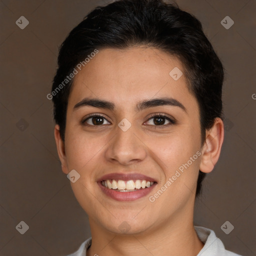 Joyful white young-adult female with short  brown hair and brown eyes