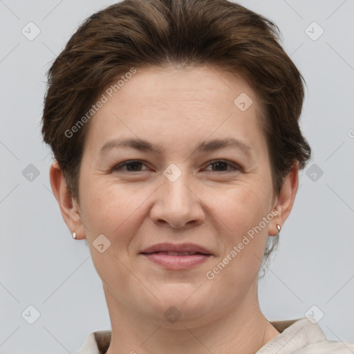 Joyful white adult female with short  brown hair and brown eyes