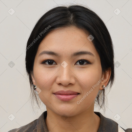 Joyful latino young-adult female with medium  black hair and brown eyes