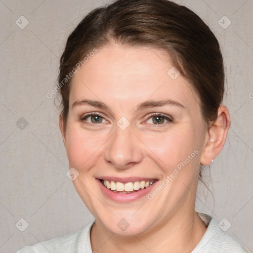 Joyful white young-adult female with medium  brown hair and blue eyes