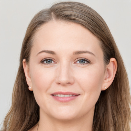 Joyful white young-adult female with long  brown hair and grey eyes