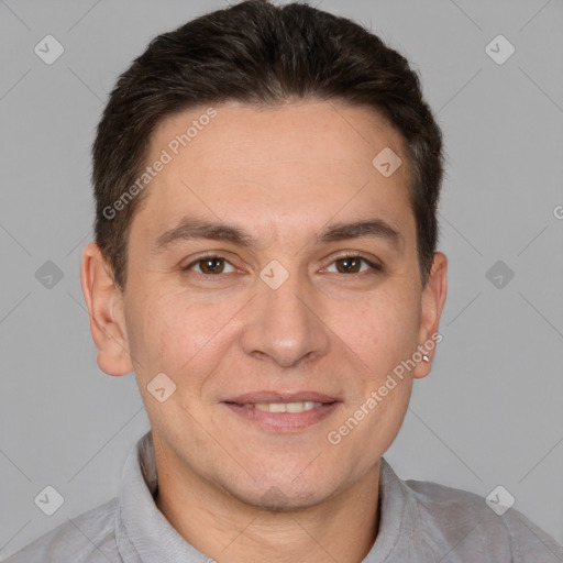 Joyful white adult male with short  brown hair and brown eyes