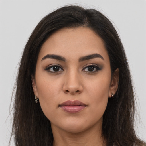 Neutral latino young-adult female with long  brown hair and brown eyes