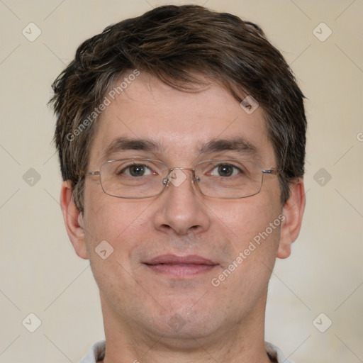 Joyful white adult male with short  brown hair and brown eyes