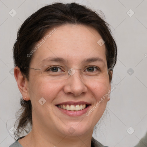 Joyful white adult female with medium  brown hair and grey eyes