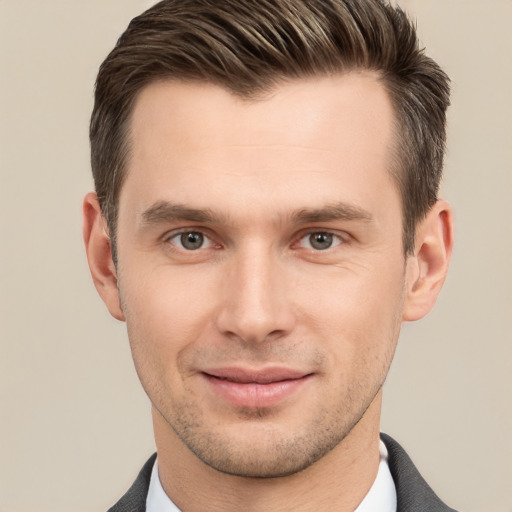 Joyful white young-adult male with short  brown hair and brown eyes