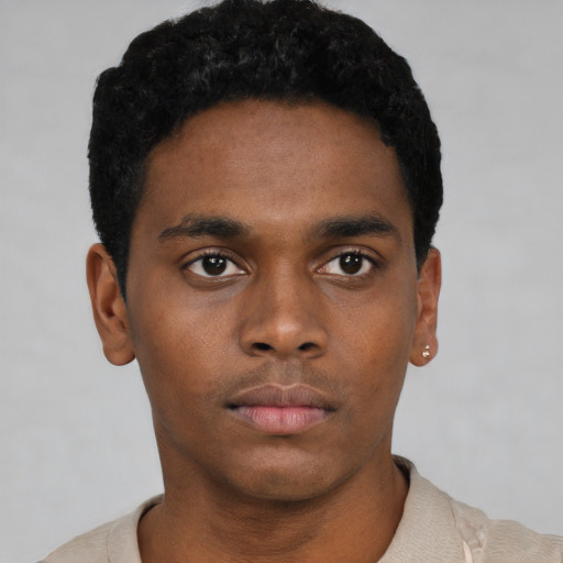 Neutral black young-adult male with short  black hair and brown eyes