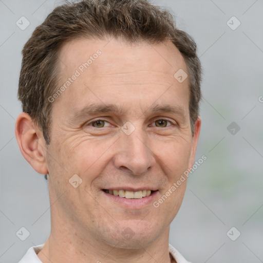 Joyful white adult male with short  brown hair and grey eyes