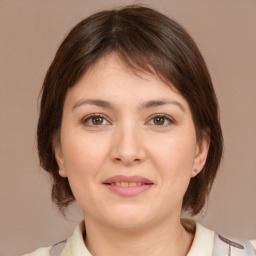 Joyful white young-adult female with medium  brown hair and brown eyes