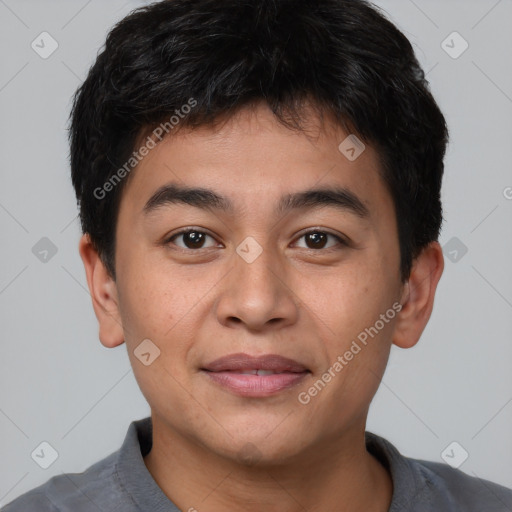 Joyful asian young-adult male with short  brown hair and brown eyes