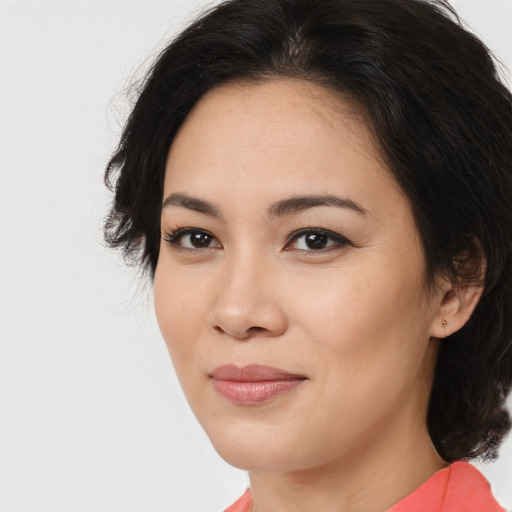 Joyful asian young-adult female with medium  brown hair and brown eyes