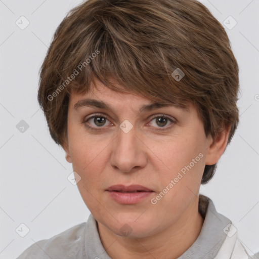 Joyful white adult female with short  brown hair and grey eyes