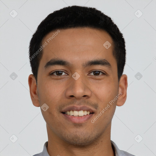 Joyful latino young-adult male with short  black hair and brown eyes