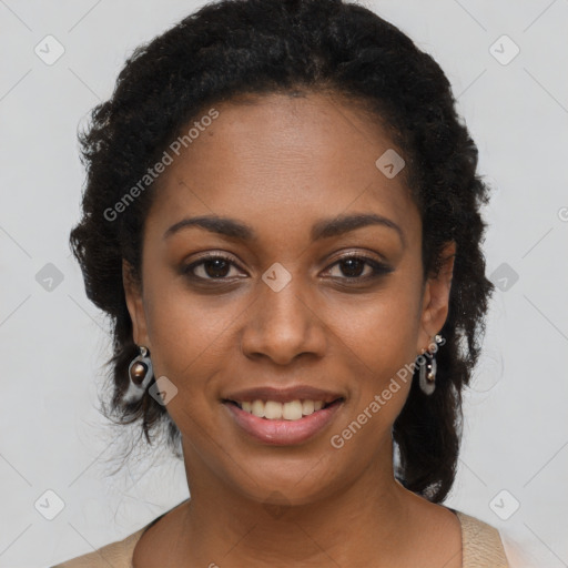 Joyful black young-adult female with long  black hair and brown eyes