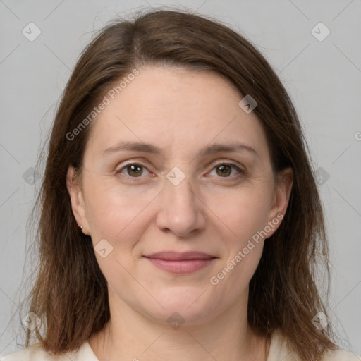 Joyful white adult female with medium  brown hair and grey eyes