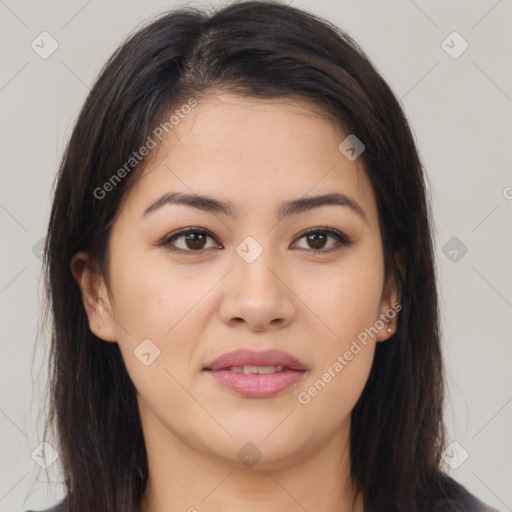 Joyful asian young-adult female with long  brown hair and brown eyes