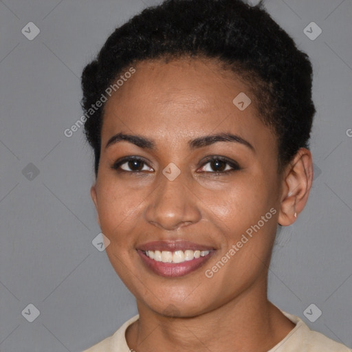 Joyful black young-adult female with short  brown hair and brown eyes