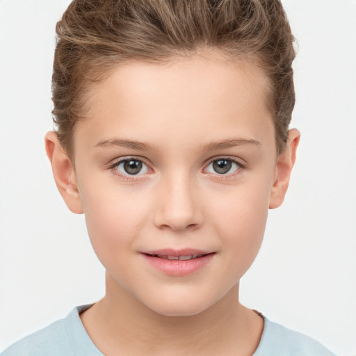 Joyful white child female with short  brown hair and brown eyes