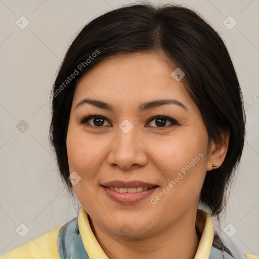 Joyful asian adult female with medium  brown hair and brown eyes