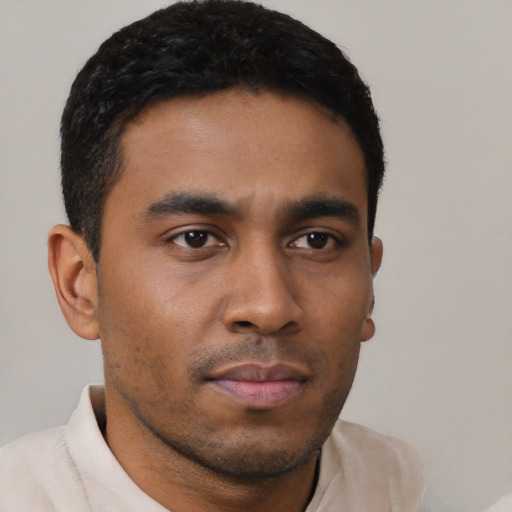 Neutral latino young-adult male with short  black hair and brown eyes
