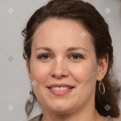 Joyful white adult female with medium  brown hair and brown eyes