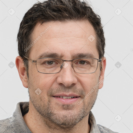 Joyful white adult male with short  brown hair and grey eyes