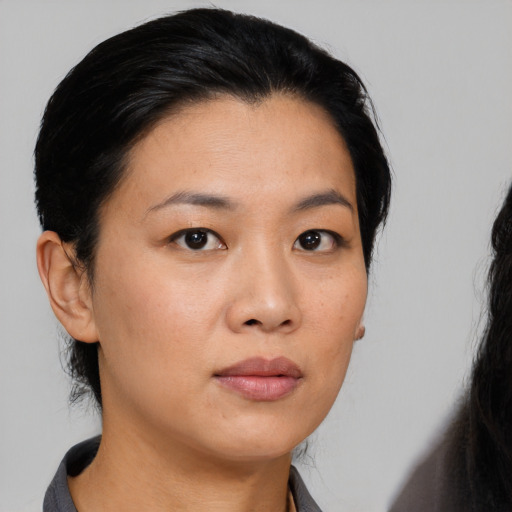 Neutral asian young-adult female with medium  black hair and brown eyes