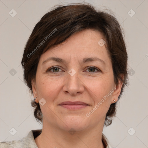 Joyful white adult female with medium  brown hair and grey eyes