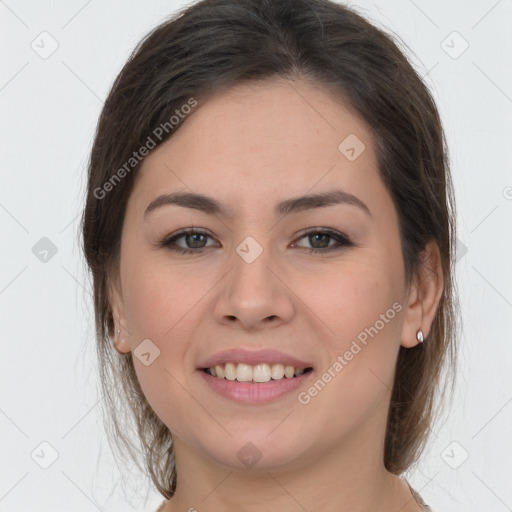 Joyful white young-adult female with long  brown hair and grey eyes