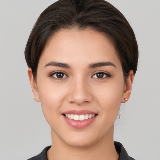 Joyful white young-adult female with short  brown hair and brown eyes