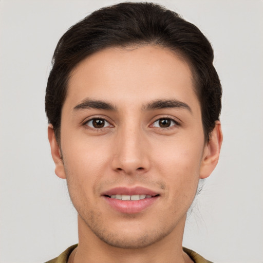 Joyful white young-adult male with short  brown hair and brown eyes