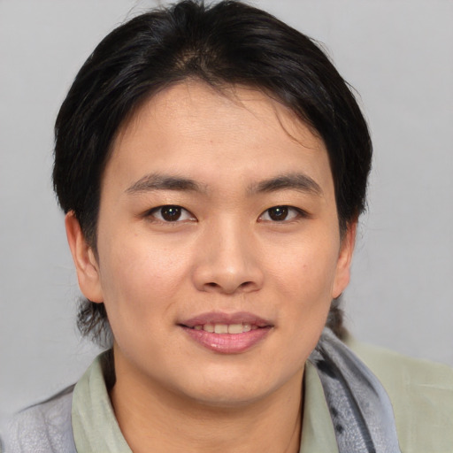 Joyful asian young-adult female with medium  brown hair and brown eyes