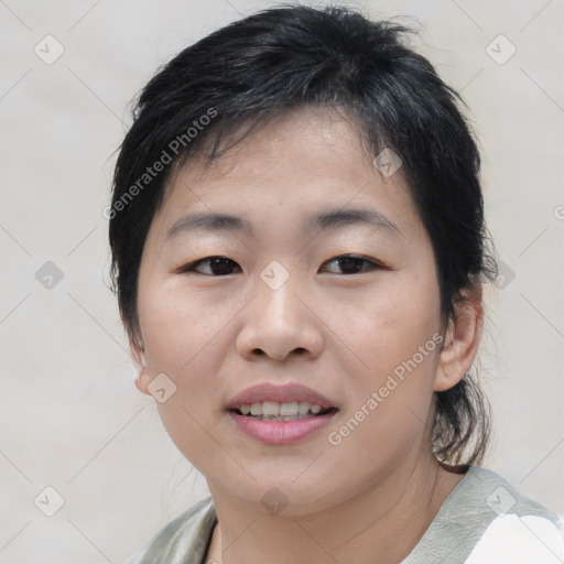 Joyful asian young-adult female with medium  brown hair and brown eyes