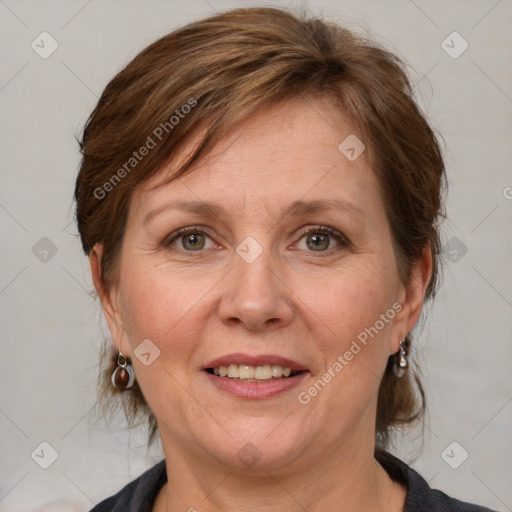 Joyful white adult female with medium  brown hair and blue eyes