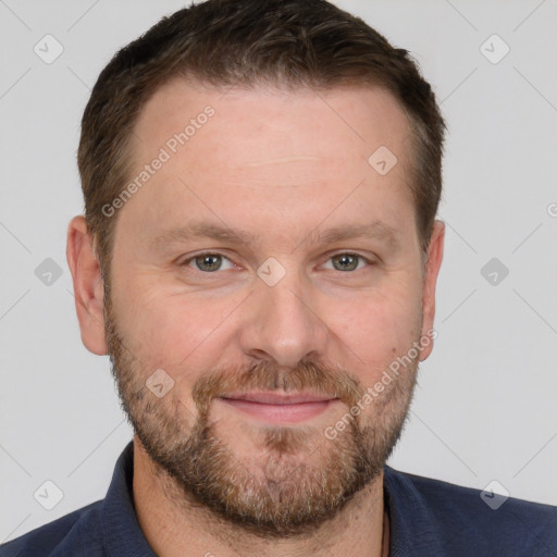 Joyful white adult male with short  brown hair and grey eyes