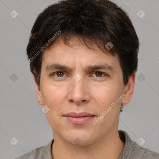 Joyful white adult male with short  brown hair and grey eyes