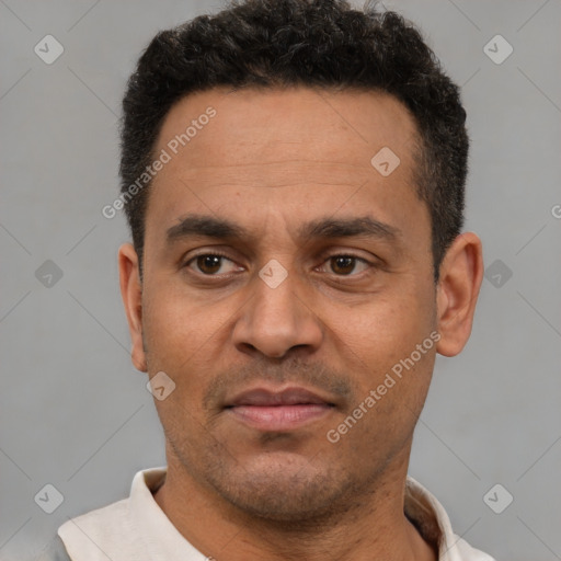 Neutral latino adult male with short  black hair and brown eyes