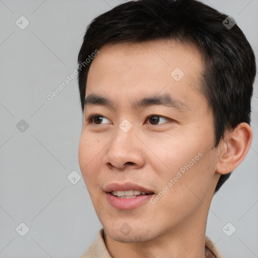 Joyful white young-adult male with short  black hair and brown eyes