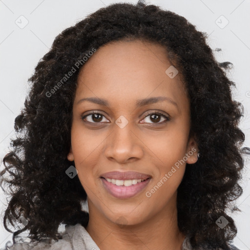 Joyful black young-adult female with long  brown hair and brown eyes